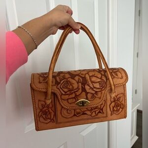 Tan and brown vintage handmade leather handbag with rose carving leather